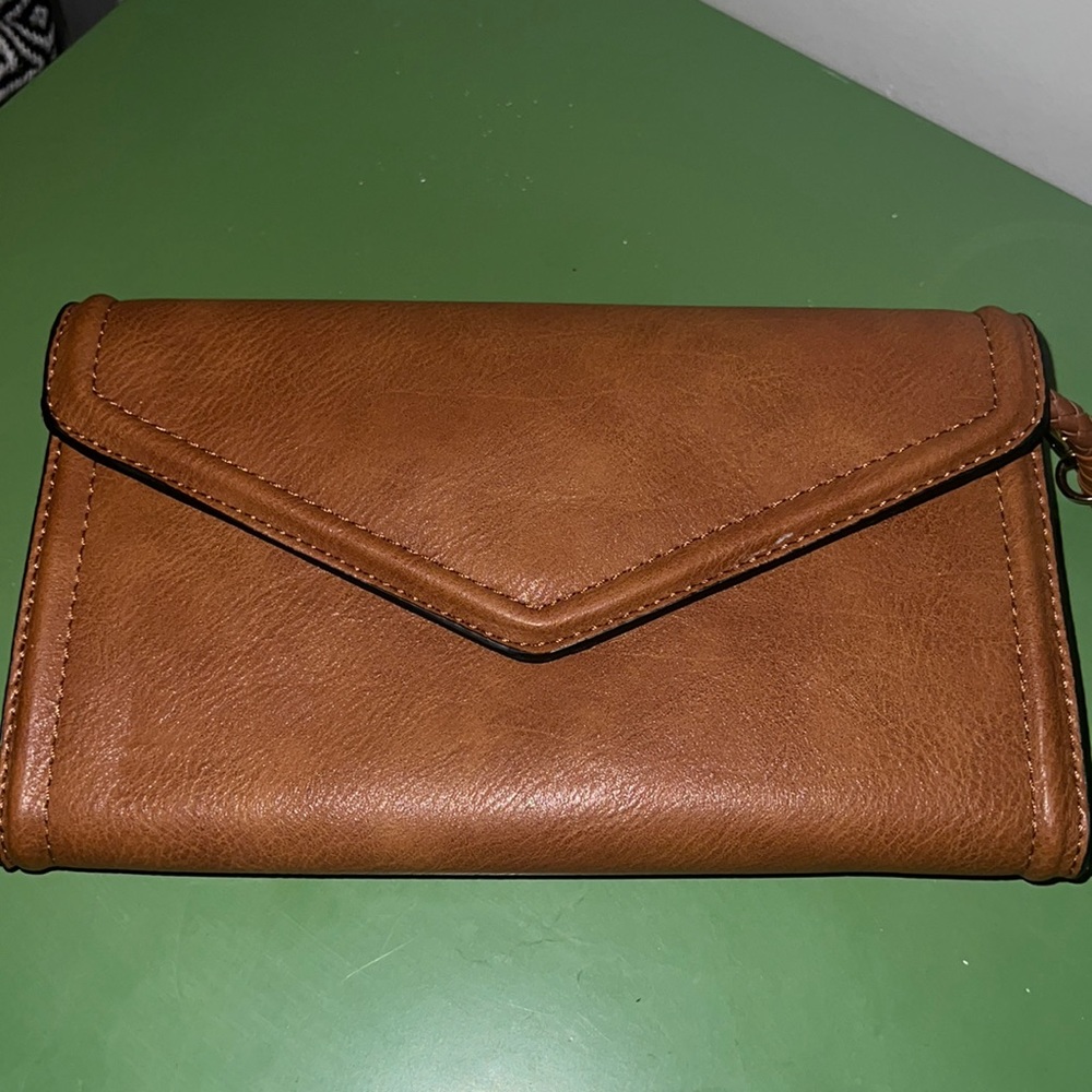 Brown clutch with long woven strap